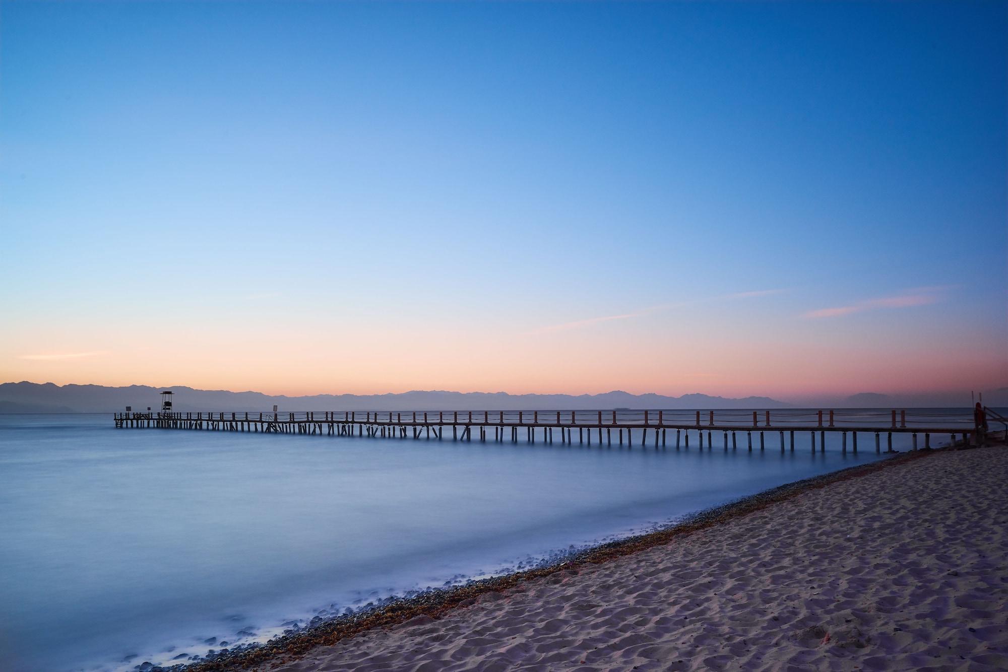 منتجع موزايك بيتش طابا هايتس المظهر الخارجي الصورة The pier at sunset